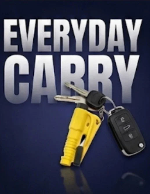 Everyday carry keychain with yellow tool and car keys on dark background